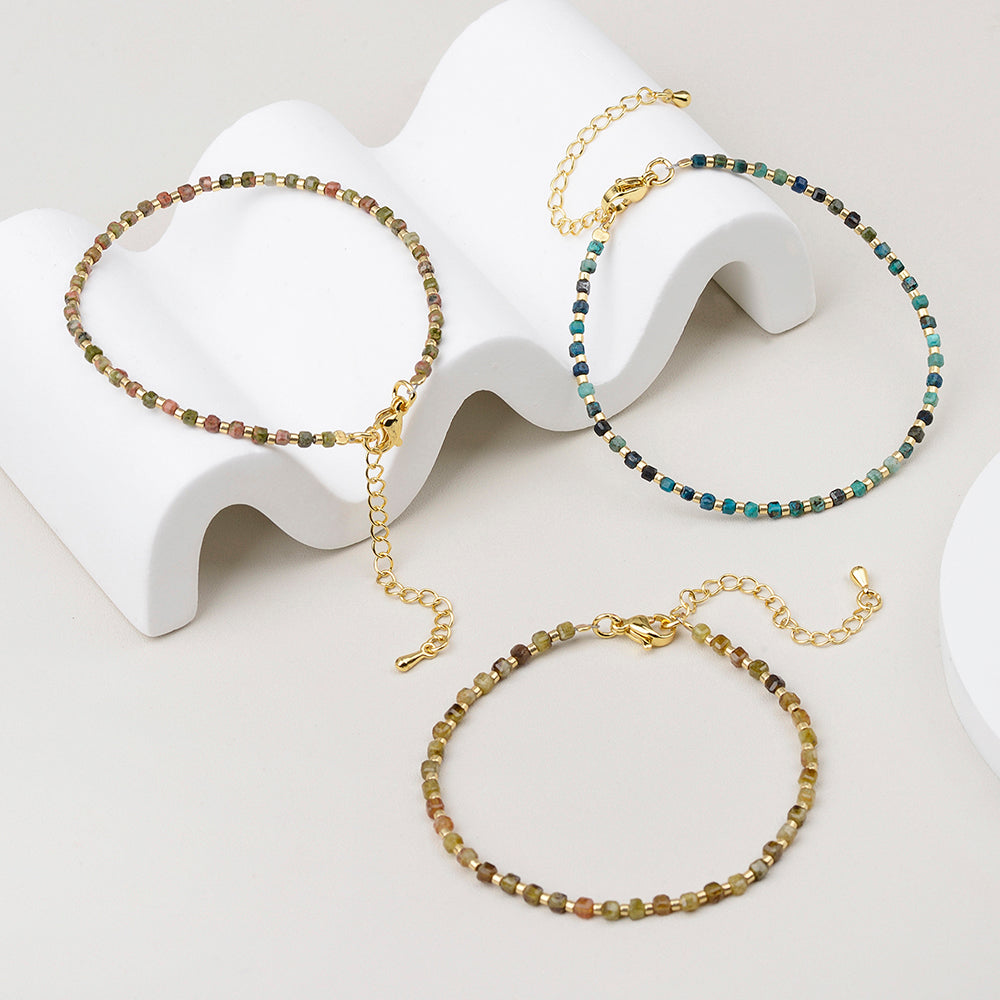 Natural gemstone beads showing differences in color pattern and transparency