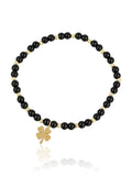 Elara Clover Black Onyx bracelet with gold-tone four-leaf clover charm